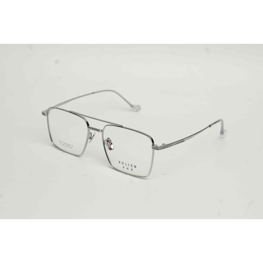 Silver eyeglasses on a light gray background Main image